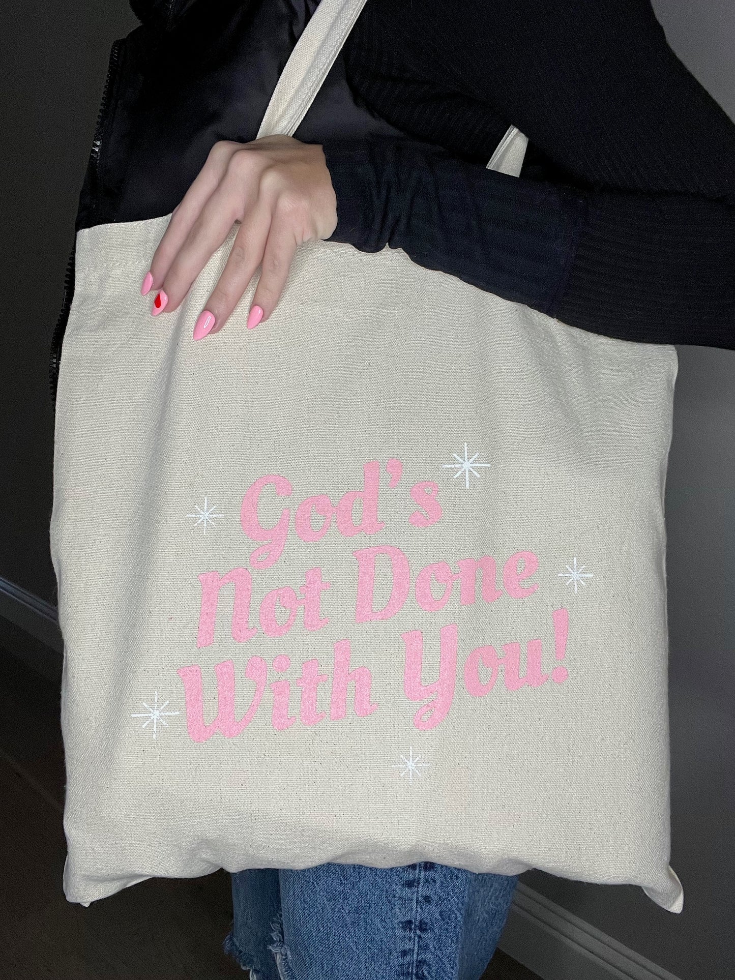 God's Not Done Tote Bag