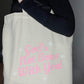 God's Not Done Tote Bag
